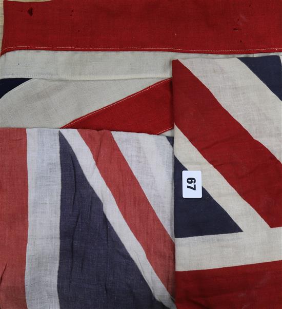 A large Union Jack banner and two small Union Jack flags